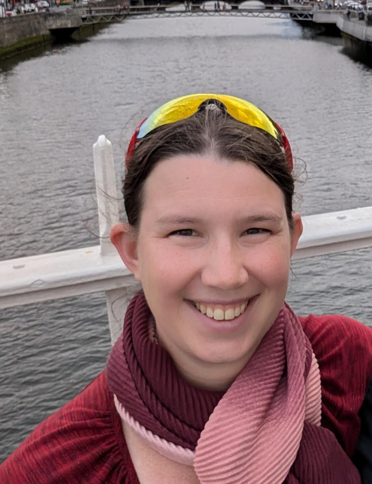Photo of S. Frances Fan, Licensed Acupuncturist smiling in front of a river.